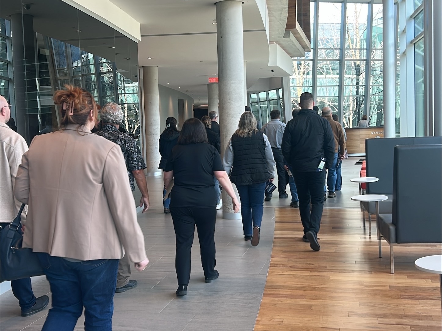 people walking in an office building