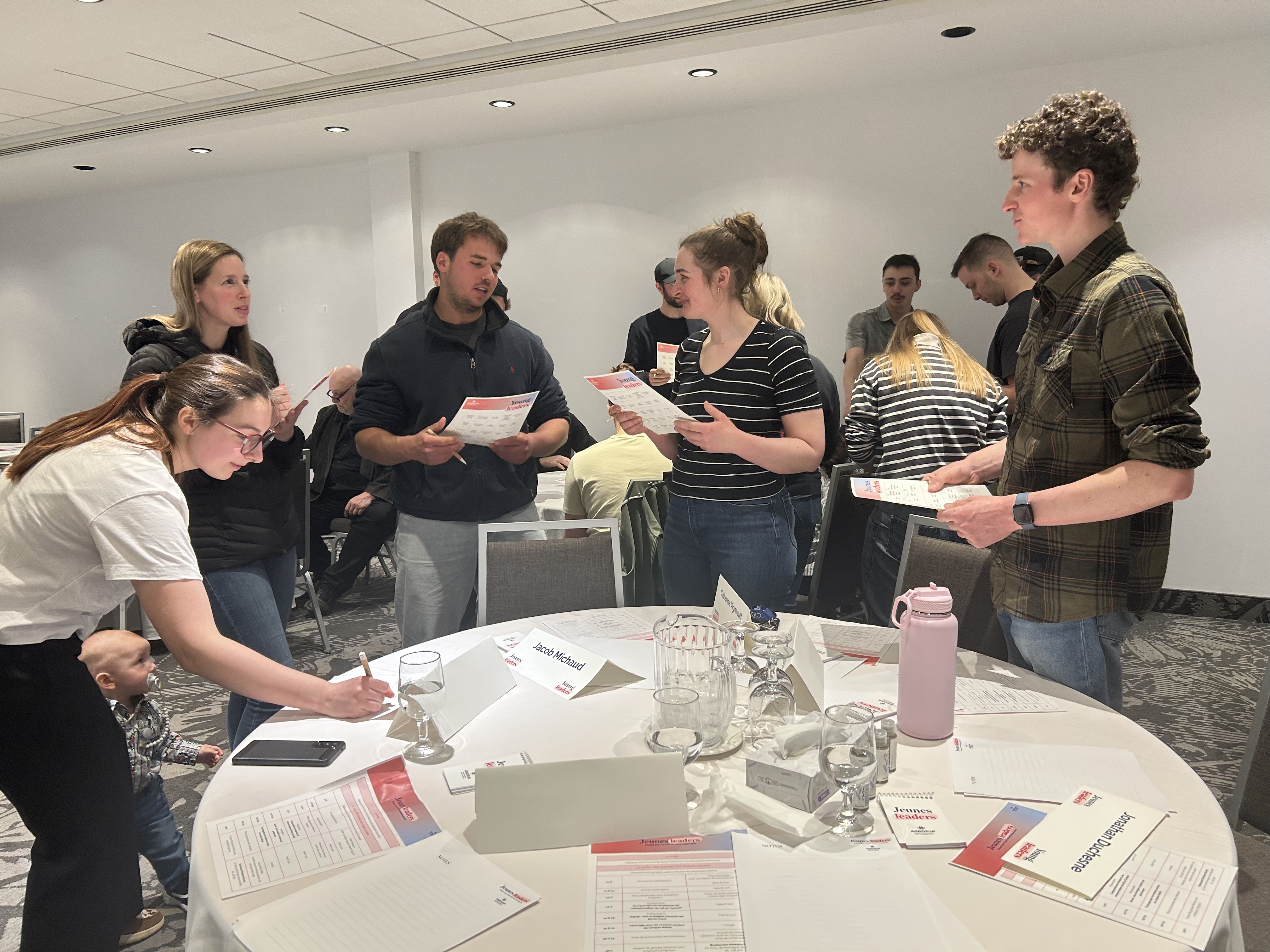 people working together at a table in a room