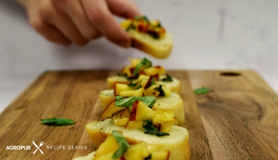 Melty mozzarella crostini with peach-basil topping