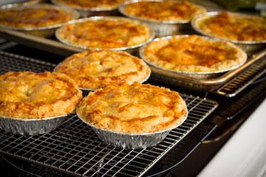 Getty 173228391 Homemade Chicken Pot Pies Cooling On Rack